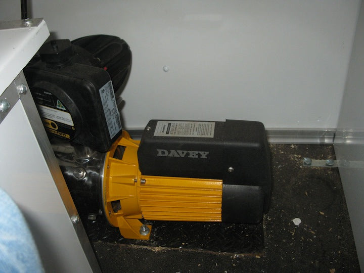 Davey motor on a black surface with a white wall in the background